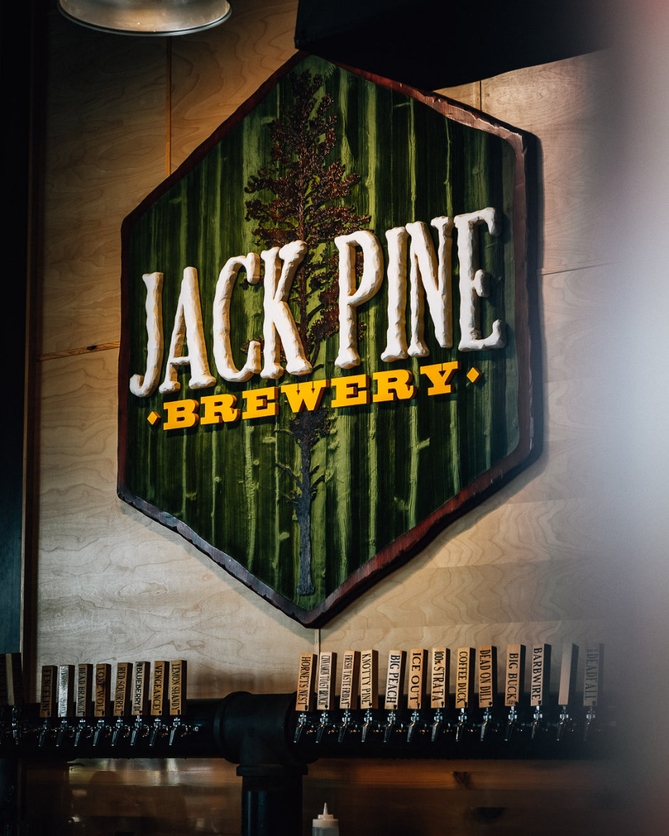 Jack Pine Sign Behind Bar